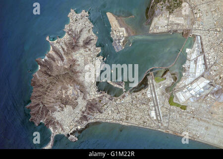 The middle eastern country of Yemen and the ancient port city of Aden located by the eastern approach to the Red Sea seen from the International Space Station. Aden's ancient, natural harbor lies in the crater of a dormant volcano which now forms a peninsula, joined to the mainland by a low isthmus. Stock Photo