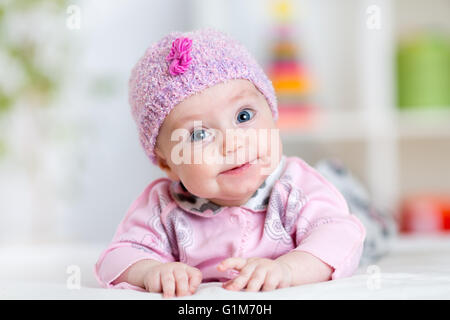 Newborn baby smiling looking at camera Stock Photo