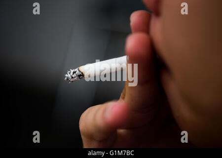 Asia Man smoking cigarette (Selective focus) Stock Photo