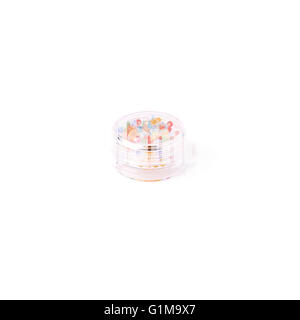 Beads in round box over white isolated background Stock Photo