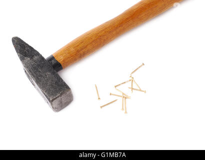 Big hammer with pile of nails over white isolated background Stock Photo
