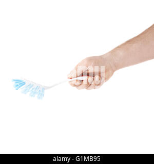 Hand holding a dish brush , composition isolated over the white background Stock Photo