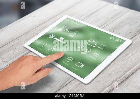 Man use smart home control on tablet. Stock Photo