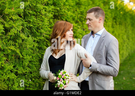 Man tenderly embraced Pregnant Woman Stock Photo