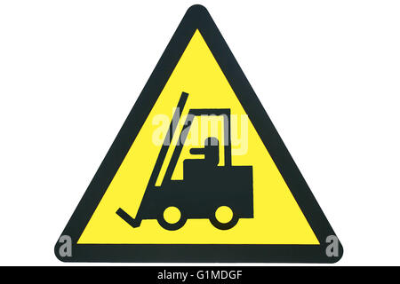 A triangular warning sign showing a forklift shape in black, against a yellow background inside a black triangular border isolated on white. Stock Photo