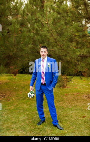 The groom in an expensive gray suit Stock Photo