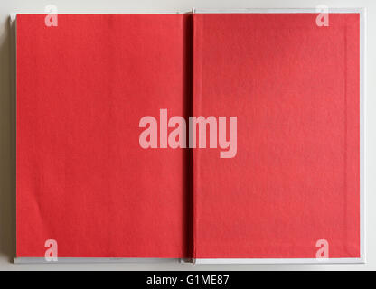 Book opened to the last page showing blank red pages inside. Stock Photo