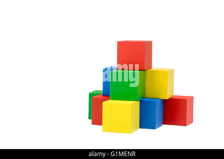 Pyramid built from variously wooden colorful cubes on an isolated white background. Stock Photo