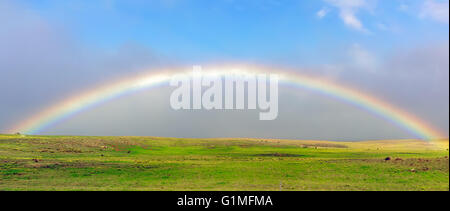 A rainbow as seen from the mist associated with clouds forming on Mt. Mauna Kea on the Big Island of Hawaii. Stock Photo