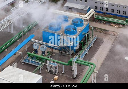 Industrial blue cooling tower at a chemical plant. Stock Photo