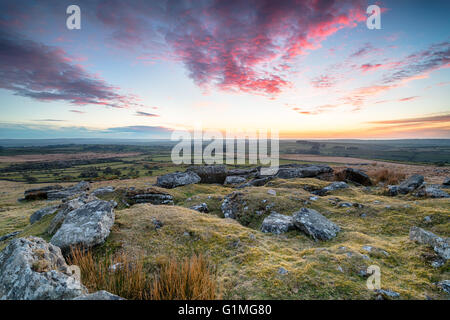 Stunning dramatic sunset over Bodmin Moor from the top of Alex Tor in Cornwall Stock Photo