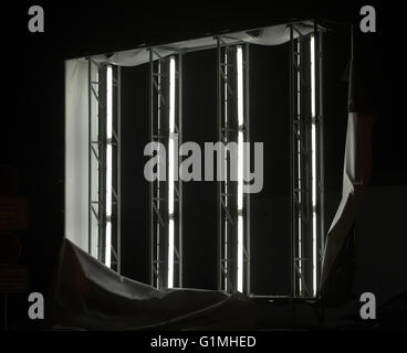 Illuminated panel ripped off showing the fluorescent tubes inside. Stock Photo