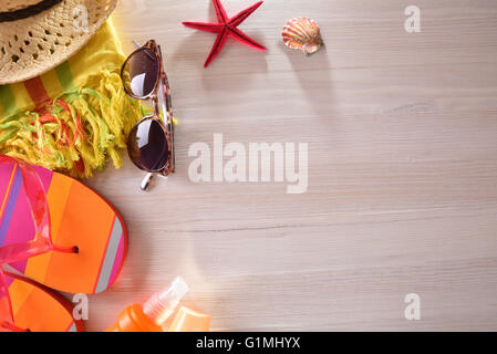 Beach articles prepared on a wooden table.Top view. Horizontal composition Stock Photo