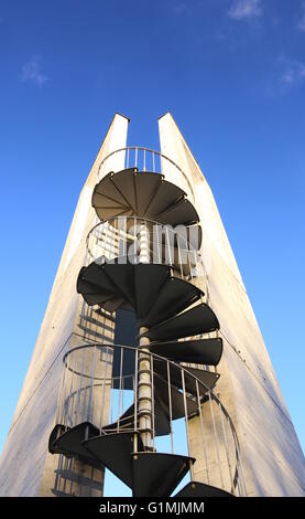 Lookout tower with spiral staircase seen from below. Stock Photo