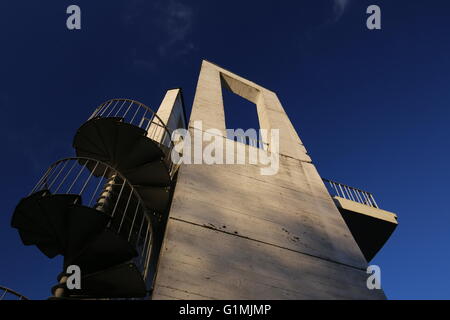 Lookout tower with spiral staircase seen from below. The sky is darkened due to the use of a polarization filter. Stock Photo