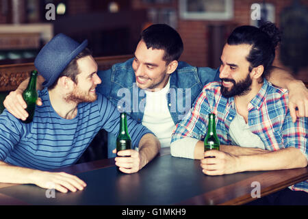 happy male friends drinking beer at bar or pub Stock Photo