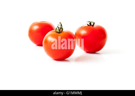 Three tomatoes isolated on a white background Stock Photo