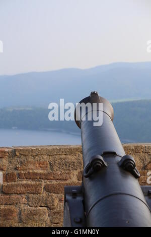 View over the mountains in Hesse, Germany, besides an old-fashioned cannon. Stock Photo