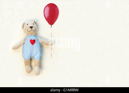 Teddy bear with red balloon Stock Photo