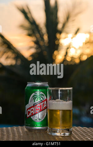Vertical close up of a poured can of Cristal beer in Cuba. Stock Photo