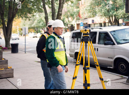 Two men surveying in the Berkshires of Massachusetts Stock Photo