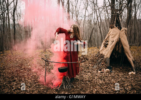 Witch in forest Stock Photo