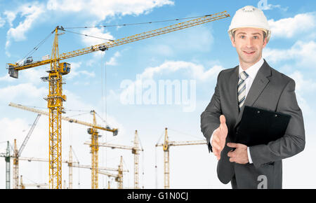Businessman in helmet Stock Photo