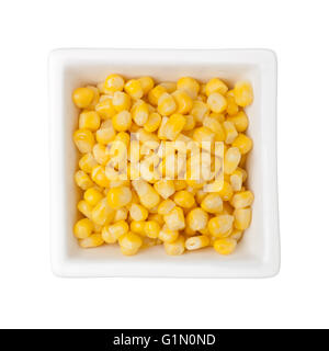 Corn kernels in a square bowl isolated on white background Stock Photo