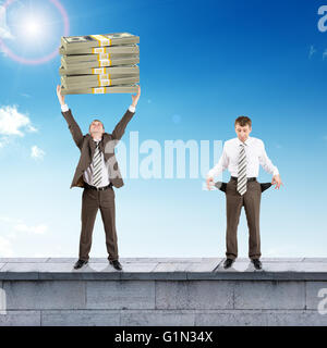 Sad and happy businesspeople with money Stock Photo