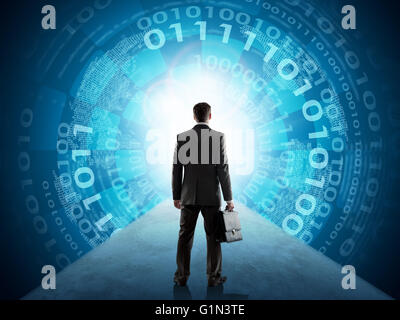 Businessman standing in front of matrix background Stock Photo