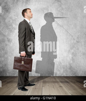 Businessman with long nose Stock Photo