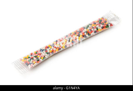 Pack of colorful sugar sprinkles isolated on white Stock Photo