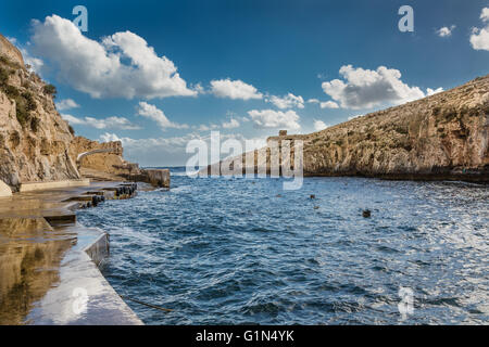 Rocky cliffs in Malta hiding many beautiful places Stock Photo