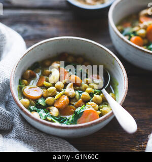 Coconut curried chickpeas with carrots & cashews Gluten-free, vegan. Stock Photo