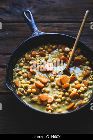Coconut curried chickpeas with carrots & cashews Gluten-free, vegan. Stock Photo