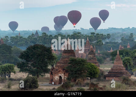 Hot-air Balloons in flight over temples of Bagan as seen from Buledi Pagoda, Burma - Myanmar Stock Photo