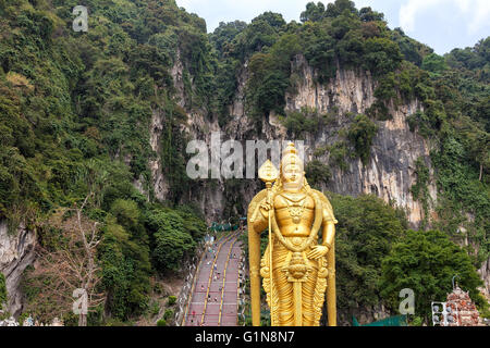 Lord Murugan Hindu Deity Statue by 272 Steps Staircase at Batu Caves Entrance in Malaysia Stock Photo