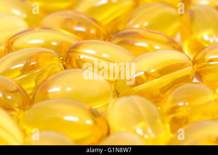 Omega 3 soft gel capsules closeup background Stock Photo