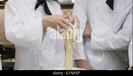 Cooker gourmets baking a pastry Stock Photo
