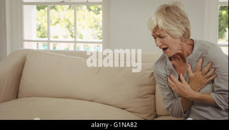 Senior woman suffering from chest pain Stock Photo