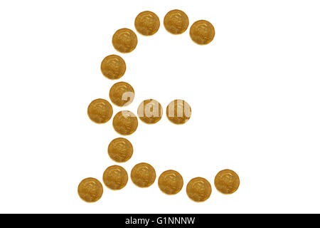 The Pound symbol created from coins photographed against a white background. Stock Photo