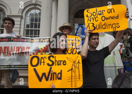 Various environmental groups including the Sierra Club joined forces at city hall in NYC to remind Mayor de Blasio to push forward with his promise to switch the city over to renewable energy sources. Stock Photo