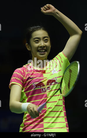 Kunshan, China's Jiangsu Province. 17th May, 2016. Wang Shixian of China celebrates after the women's singles match against Carolina Marin of Spain in the Group A match at the Uber Cup badminton championship in Kunshan, east China's Jiangsu Province, May 17, 2016. Wang Shixian won 2-1. © Han Yuqing/Xinhua/Alamy Live News Stock Photo