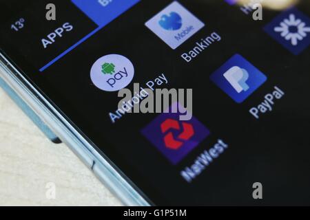 Android Pay and several UK banking apps installed on a Android phone. Stock Photo