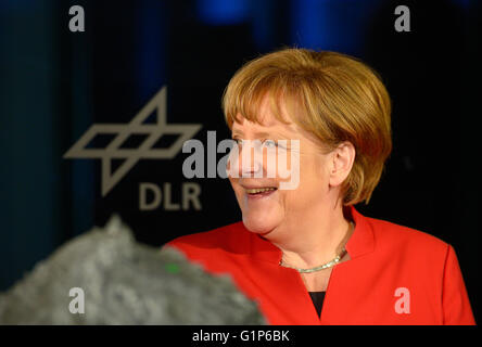 Cologne, Germany. 18th May, 2016. German Chancellor Angela Merkel smiles during a visit to the European Astronauts Center (EAC) of the European Space Ageny (ESA) in Cologne, Germany, on May 18, 2016. Photo: Sascha Schuermann/dpa/Alamy Live News Stock Photo