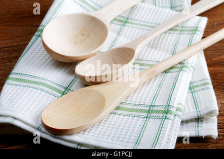 kitchen towel and wooden spoon on the table Stock Photo