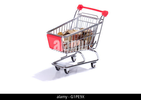 Miniature shopping cart with Euro coins, money, isolated on white background Stock Photo