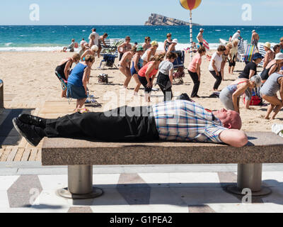 Pensioners exercising on the beach. Stock Photo