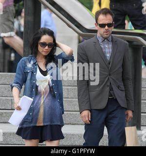 LONDON, UK - JULY 10, 2013: Lucy Liu and Jonny Lee Miller sighting on set filming Elementary in Trafalgar Square in London Stock Photo