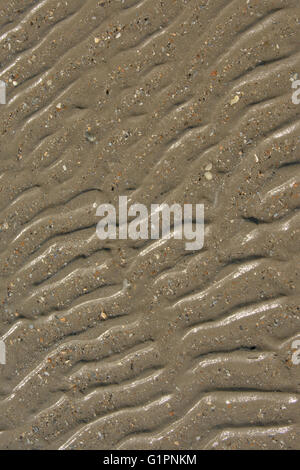Background of wet wavy sand, view from above Stock Photo